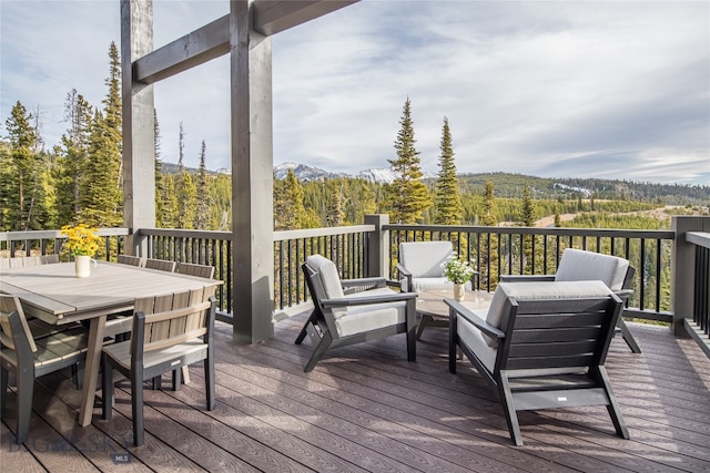 wooden deck with a mountain view