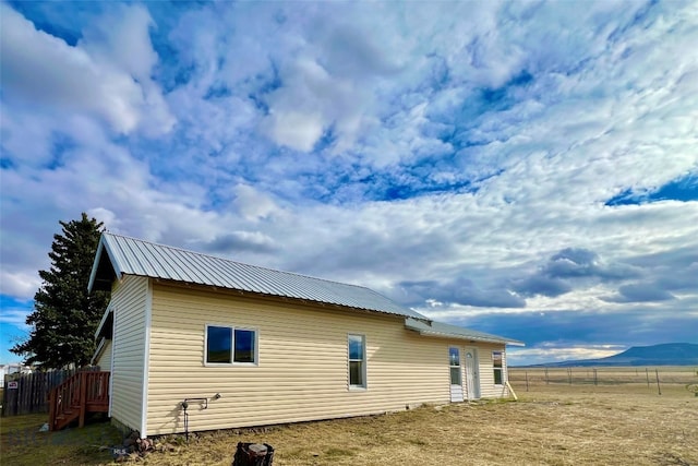 view of property exterior featuring a mountain view