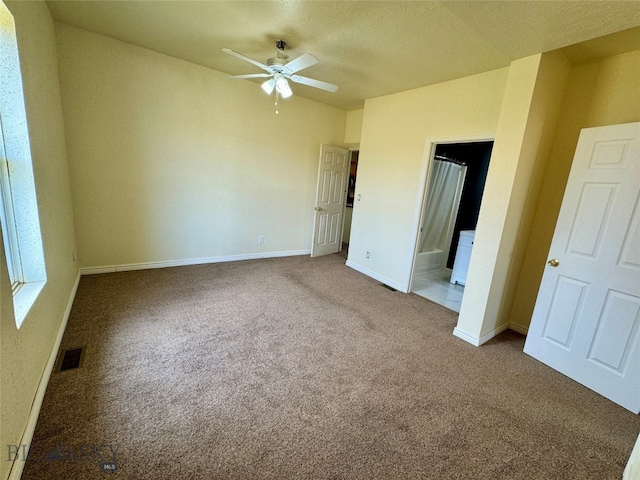 spare room with ceiling fan and carpet floors