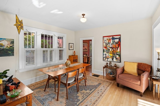 dining room with light hardwood / wood-style flooring