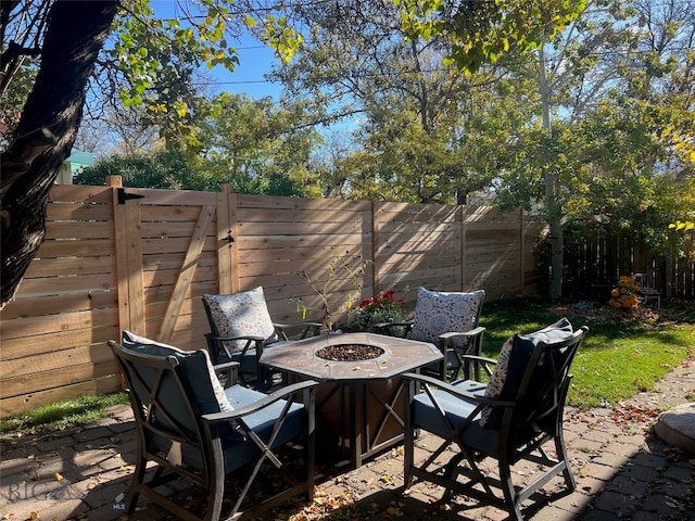 view of patio with a fire pit