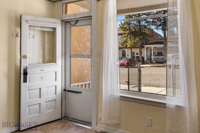 doorway to outside with plenty of natural light