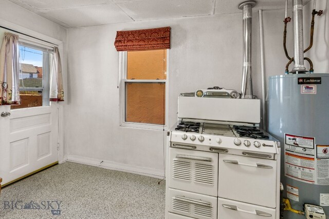 kitchen featuring a drop ceiling and water heater