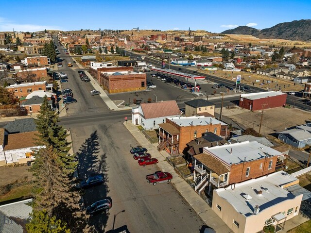 drone / aerial view featuring a mountain view