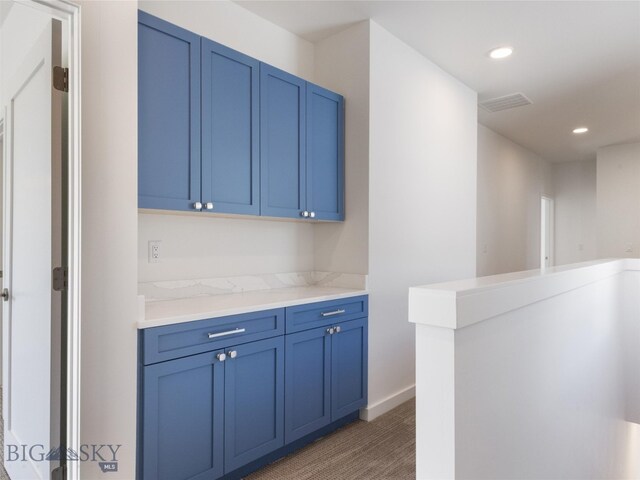 bar with blue cabinets