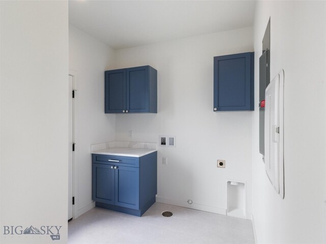 clothes washing area with cabinets, washer hookup, electric dryer hookup, and electric panel