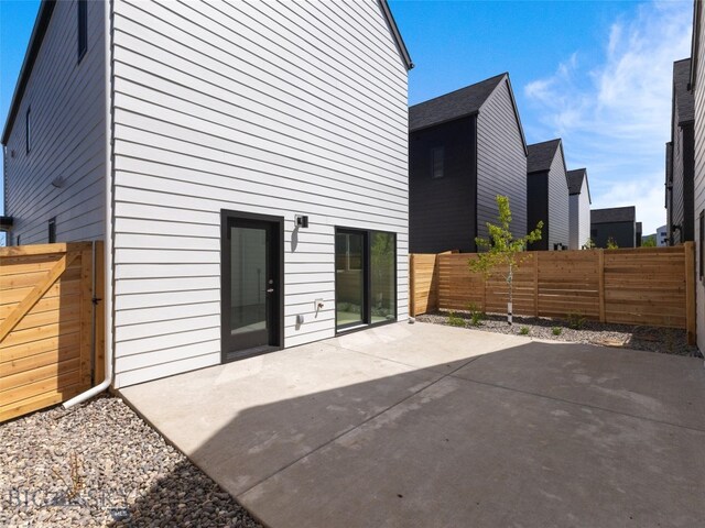 back of house with a patio area