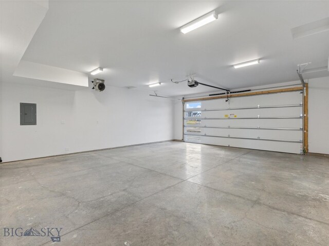 garage featuring a garage door opener and electric panel