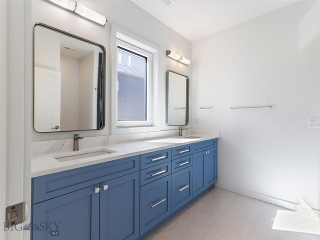 bathroom with vanity and tile patterned floors