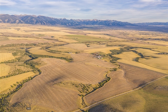 drone / aerial view with a mountain view and a rural view