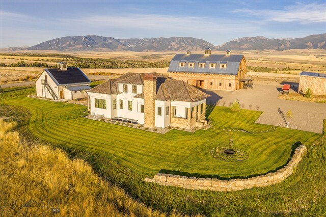 birds eye view of property with a mountain view