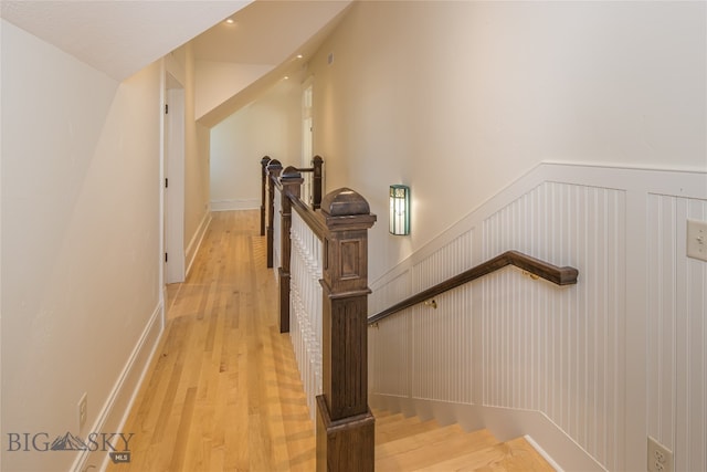 stairs with hardwood / wood-style floors