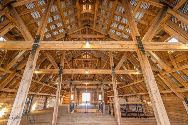 misc room featuring hardwood / wood-style flooring and vaulted ceiling