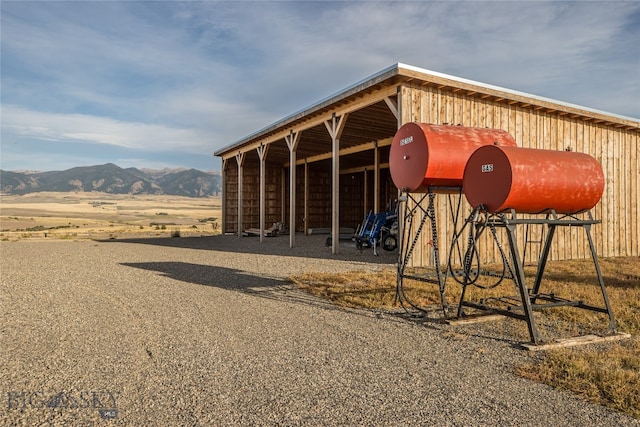 view of stable featuring a mountain view