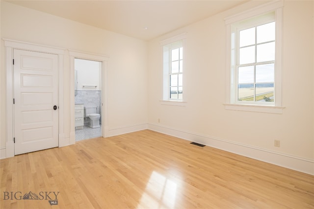 empty room with light wood-type flooring