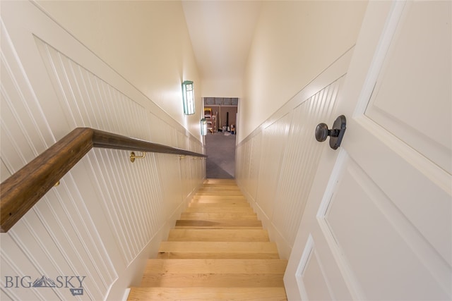 stairs featuring hardwood / wood-style flooring