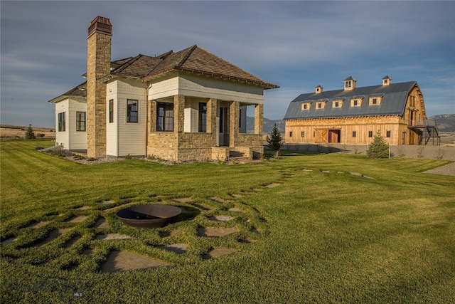 rear view of house with a lawn