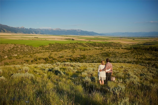 mountain view featuring a rural view