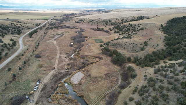 birds eye view of property featuring a rural view