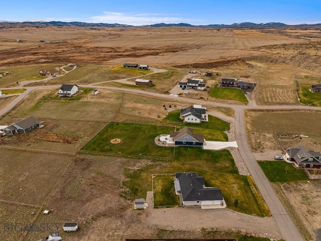 drone / aerial view featuring a mountain view