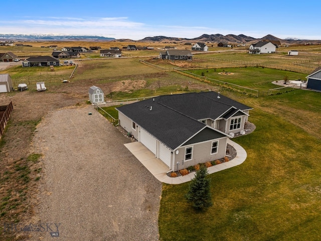 birds eye view of property featuring a mountain view