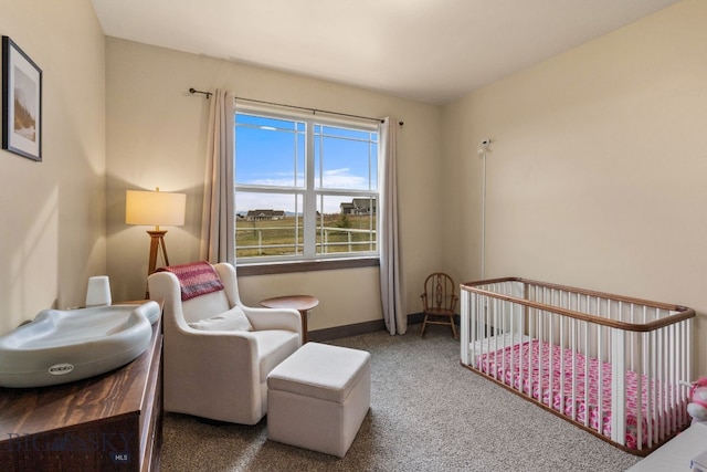 bedroom with carpet flooring and a crib