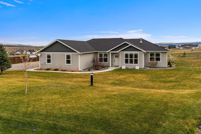 ranch-style house featuring a front lawn