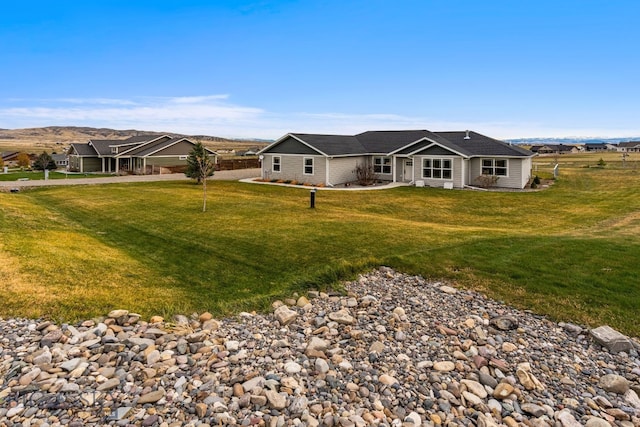 rear view of house with a lawn