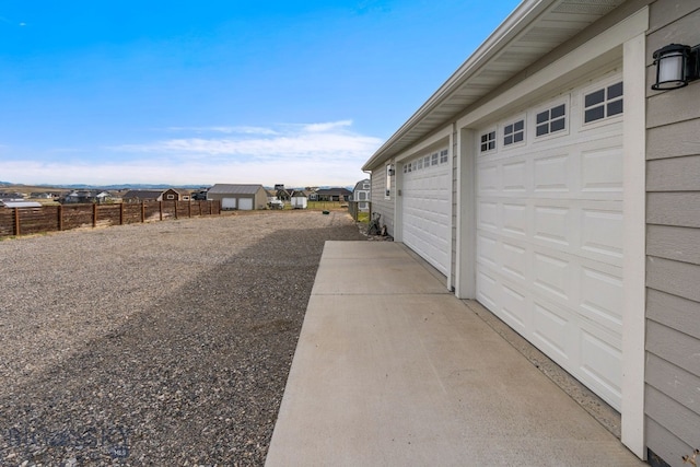 view of yard with an outbuilding and a garage