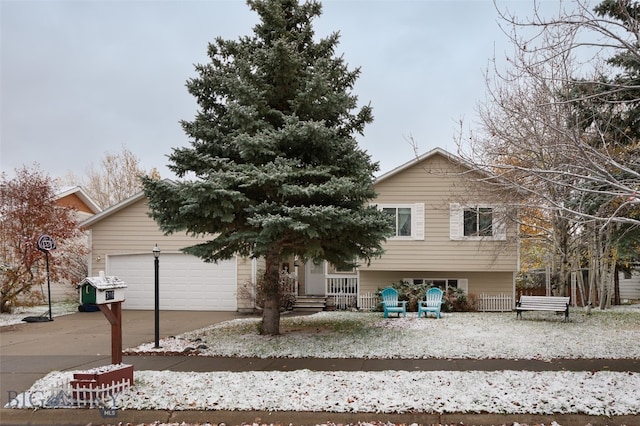 view of front of property featuring a garage and covered porch