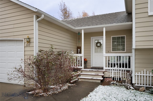 view of exterior entry featuring a garage