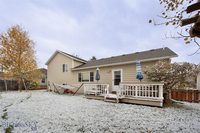 back of property featuring a wooden deck