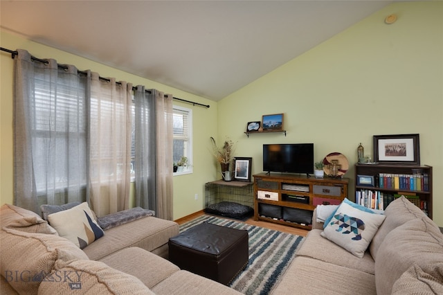 living room featuring hardwood / wood-style floors and vaulted ceiling