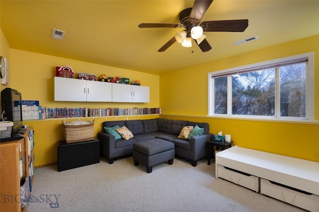 living room with ceiling fan and light carpet