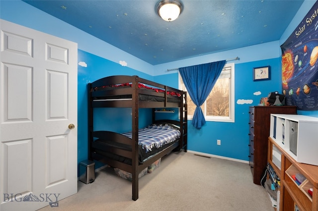 bedroom featuring light carpet