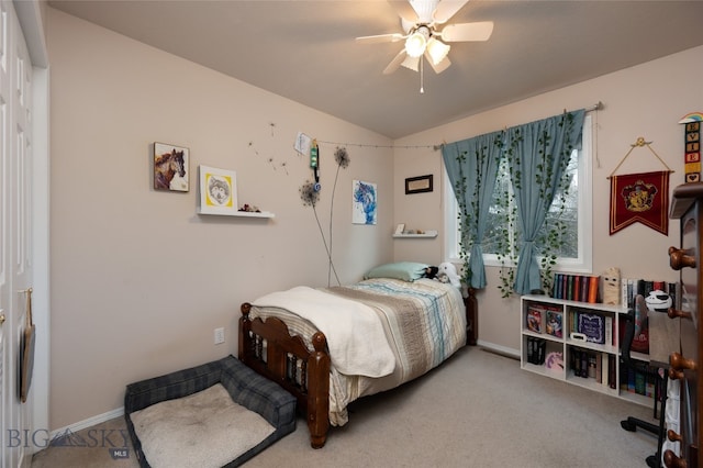 bedroom featuring light colored carpet, lofted ceiling, and ceiling fan