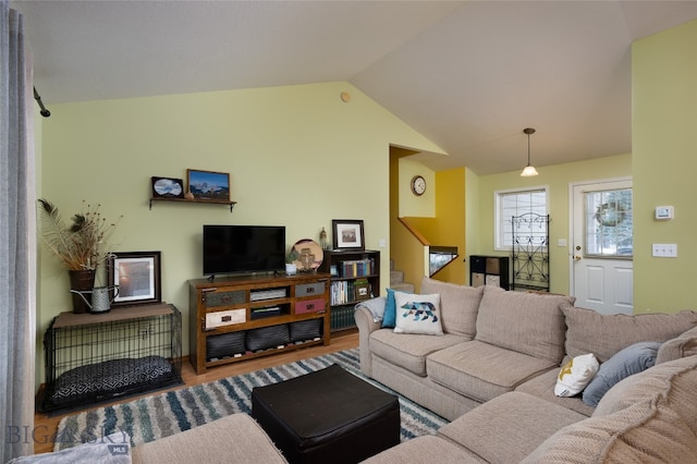 living room with lofted ceiling and hardwood / wood-style floors