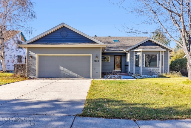 view of front of home with a garage and a front yard