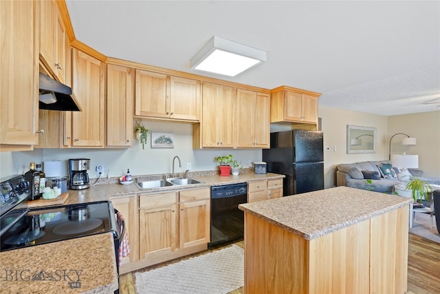 kitchen featuring light brown cabinets, sink, black appliances, and light hardwood / wood-style flooring