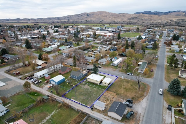 drone / aerial view featuring a mountain view