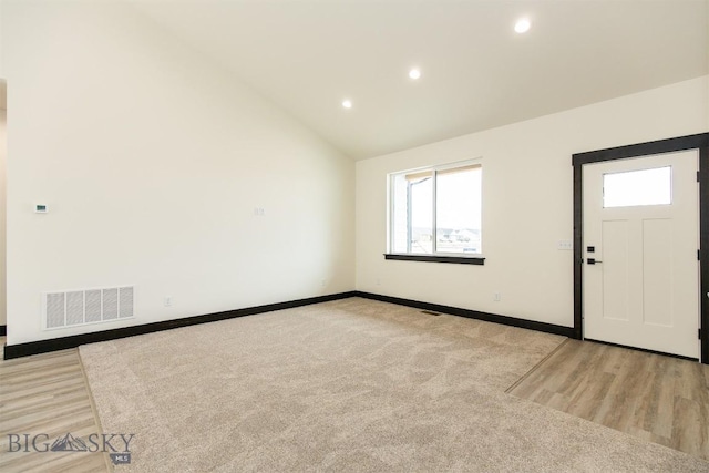 1511 Pistolero Way, Belgrade, MT 59714 - entryway featuring recessed lighting, baseboards, wood finished floors, and high vaulted ceiling