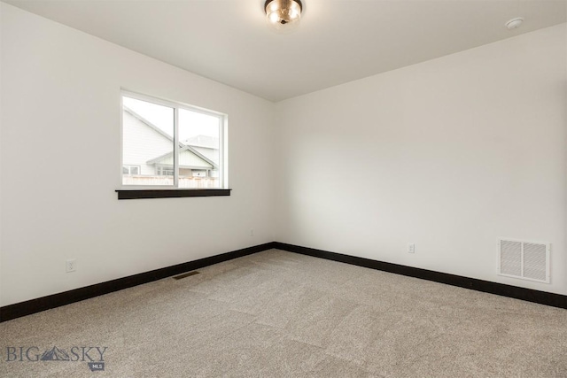 1511 Pistolero Way, Belgrade, MT 59714 - carpeted empty room with a smoke detector and baseboards