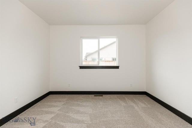 1511 Pistolero Way, Belgrade, MT 59714 - carpeted empty room with baseboards