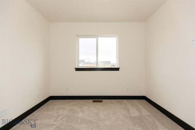 1511 Pistolero Way, Belgrade, MT 59714 - carpeted empty room with baseboards