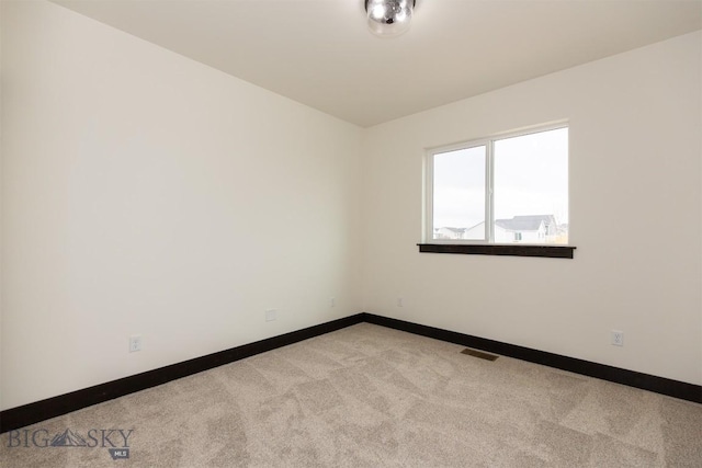 1511 Pistolero Way, Belgrade, MT 59714 - carpeted spare room featuring baseboards