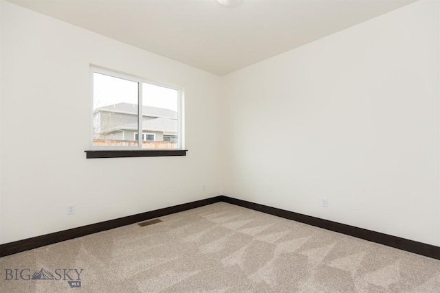 1511 Pistolero Way, Belgrade, MT 59714 - carpeted spare room with baseboards