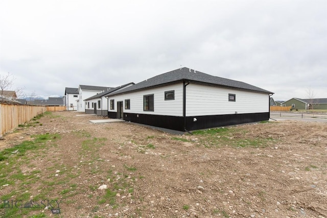 1511 Pistolero Way, Belgrade, MT 59714 - view of side of property featuring fence