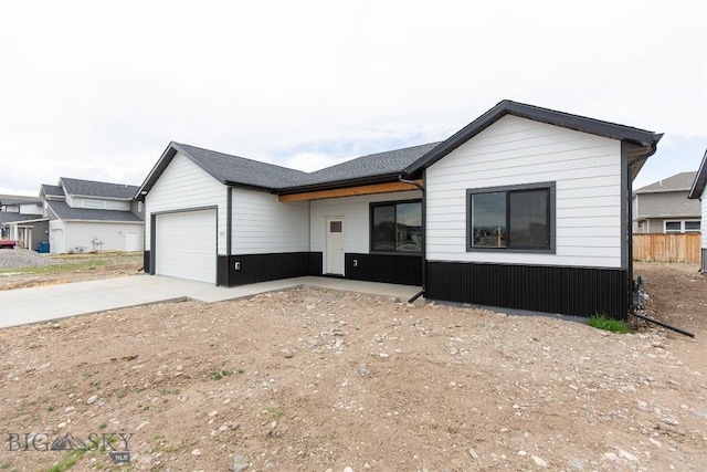 1511 Pistolero Way, Belgrade, MT 59714 - view of front of home featuring an attached garage and concrete driveway