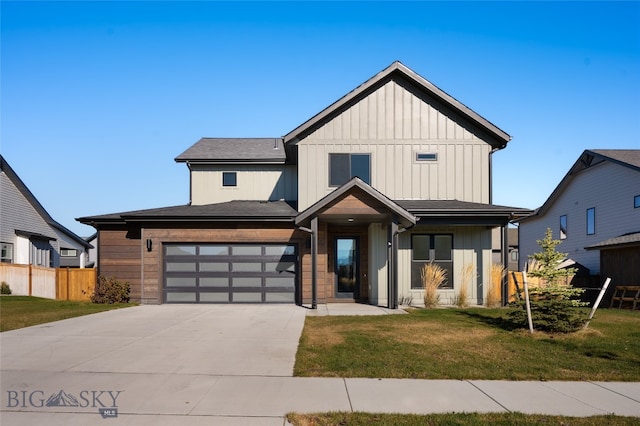 modern farmhouse style home with a front yard and a garage