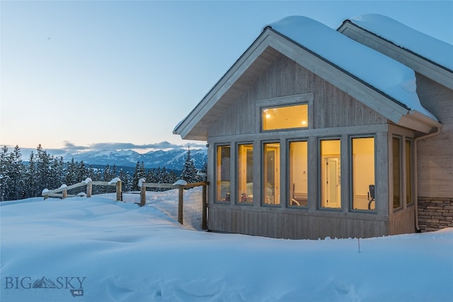 view of snowy exterior with a mountain view